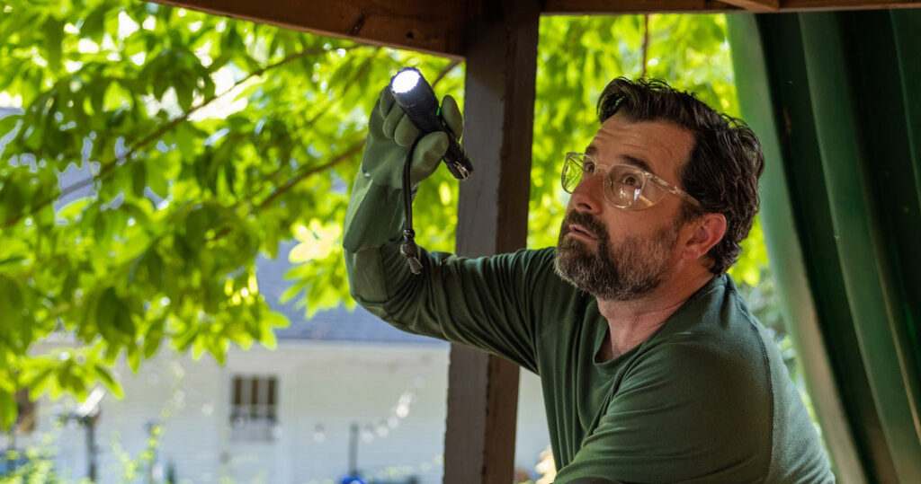 photo of Aptive technician inspecting a home