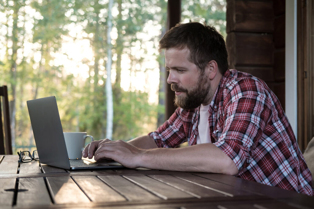 photo of man in a cabin using Starlink satellite internet