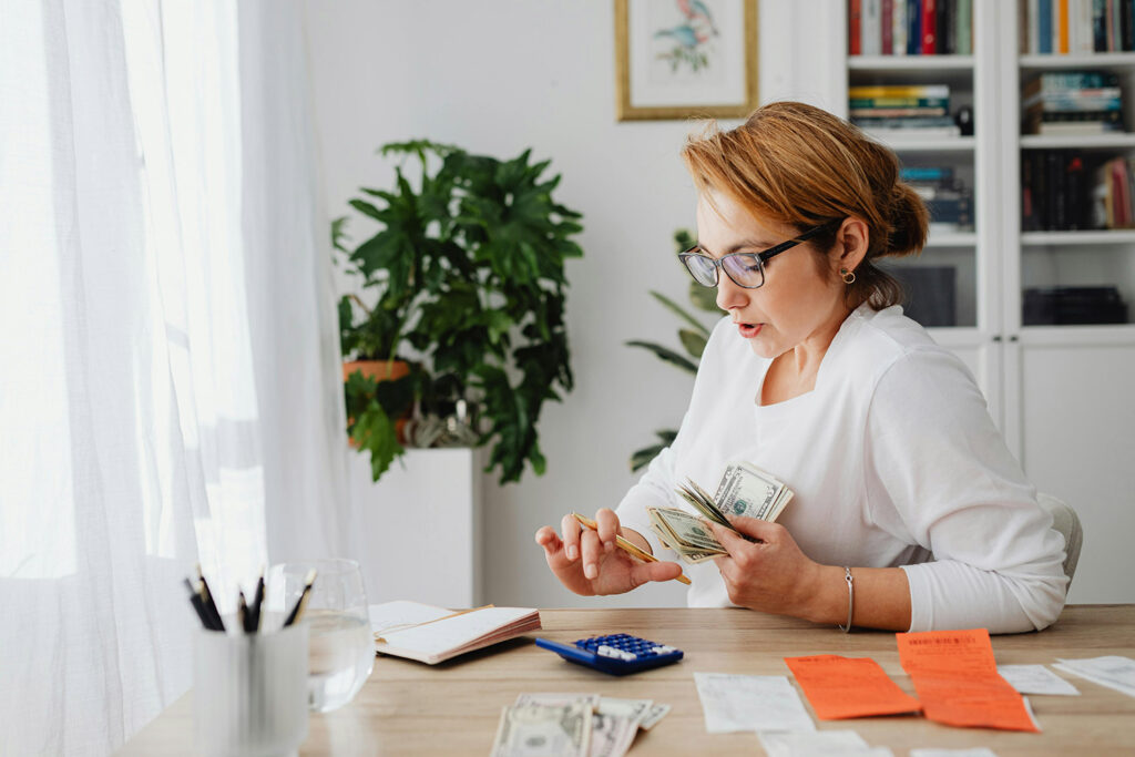 a woman uses YNAB to keep track of spending